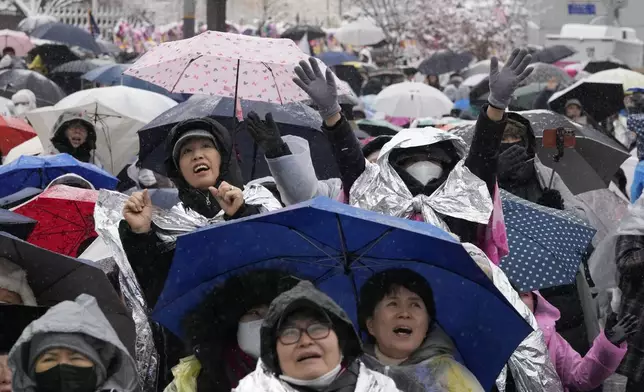 Supporters of impeached South Korean President Yoon Suk Yeol attend a Sunday service as they gather to oppose his impeachment near the presidential residence in Seoul, South Korea, Sunday, Jan. 5, 2025. (AP Photo/Ahn Young-joon)