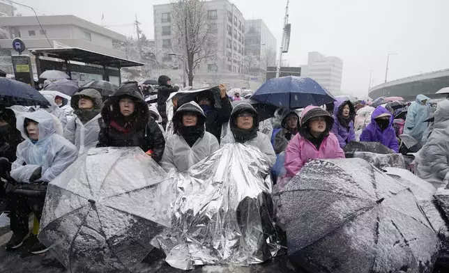 Supporters of impeached South Korean President Yoon Suk Yeol attend a Sunday service as they gather to oppose his impeachment near the presidential residence in Seoul, South Korea, Sunday, Jan. 5, 2025. (AP Photo/Ahn Young-joon)