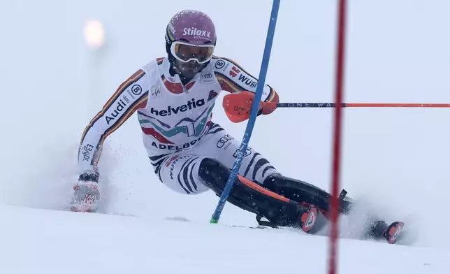 Germany's Linus Strasser speeds down the course during an alpine ski, men's World Cup slalom race, in Adelboden, Switzerland, Saturday, Jan. 11, 2025. (AP Photo/Gabriele Facciotti)