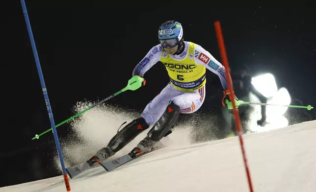 Norway's Timon Haugan speeds down the course during an alpine ski, men's World Cup slalom in Madonna di Campiglio, Italy, Wednesday, Jan.8, 2025. (AP Photo/Alessandro Trovati