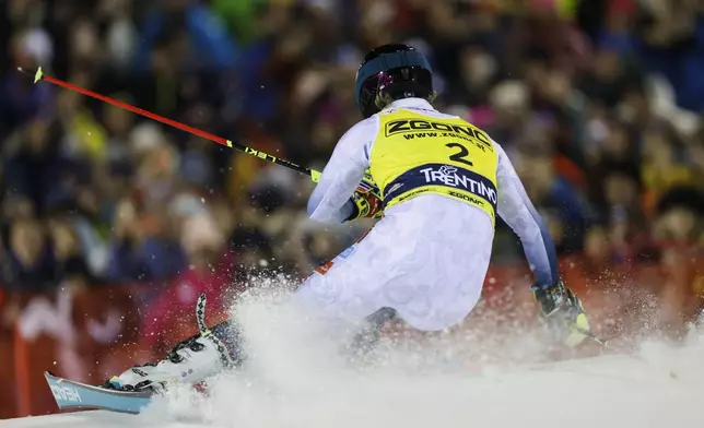 Norway's Atle Lie McGrath speeds down the course during an alpine ski, men's World Cup slalom in Madonna di Campiglio, Italy, Wednesday, Jan.8, 2025. (AP Photo/Alessandro Trovati