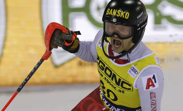 Bulgaria's Albert Popov gets to the finish area after completing an alpine ski, men's World Cup slalom in Madonna di Campiglio, Italy, Wednesday, Jan.8, 2025. (AP Photo/Alessandro Trovati)