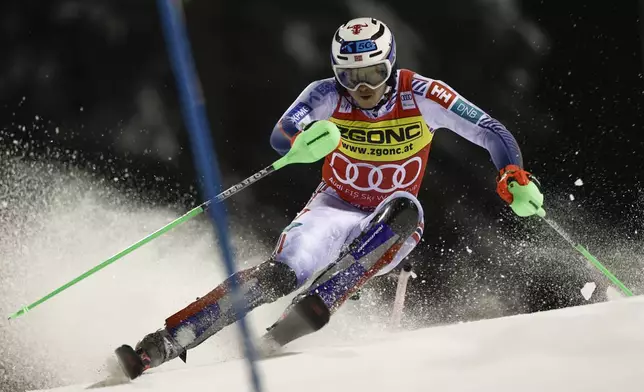 Norway's Henrik Kristoffersen speeds down the course during an alpine ski, men's World Cup slalom in Madonna di Campiglio, Italy, Wednesday, Jan.8, 2025. (AP Photo/Gabriele Facciotti)