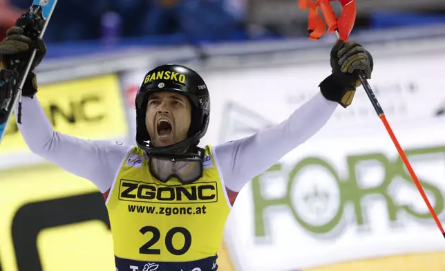 Bulgaria's Albert Popov celebrates winning an alpine ski, men's World Cup slalom in Madonna di Campiglio, Italy, Wednesday, Jan.8, 2025. (AP Photo/Alessandro Trovati)