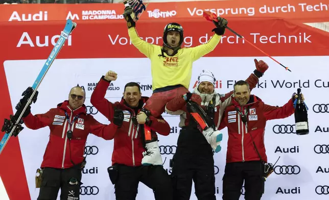 Bulgaria's Albert Popov celebrates winning an alpine ski, men's World Cup slalom in Madonna di Campiglio, Italy, Wednesday, Jan.8, 2025. (AP Photo/Alessandro Trovati)