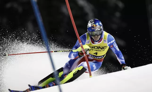 France's Clement Noel speeds down the course during an alpine ski, men's World Cup slalom in Madonna di Campiglio, Italy, Wednesday, Jan.8, 2025. (AP Photo/Gabriele Facciotti)