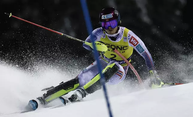 Norway's Atle Lie McGrath speeds down the course during an alpine ski, men's World Cup slalom in Madonna di Campiglio, Italy, Wednesday, Jan.8, 2025. (AP Photo/Gabriele Facciotti)