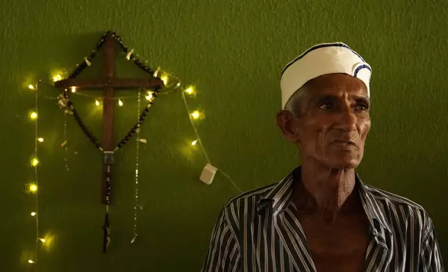 Jose Mario sings during a performance, by the Santo Antonio Folia de Reis group, marking Epiphany, or Three Kings Day, in Santo Antonio de Goias, Brazil, Sunday, Jan. 5, 2025. (AP Photo/Eraldo Peres)