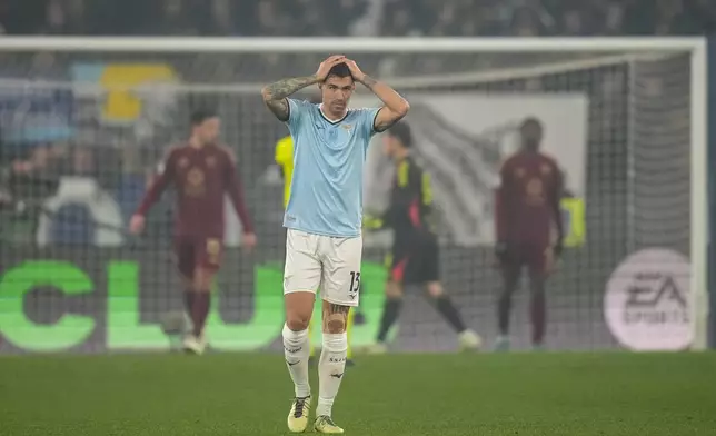 Lazio's Alessio Romagnoli reacts during a Serie A soccer match between Roma and Lazio, at the Stadio Olimpico in Rome, Italy, Sunday, Jan. 5, 2025. (AP Photo/Alessandra Tarantino)