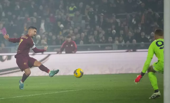 Roma's Lorenzo Pellegrini, left, kicks the ball during a Serie A soccer match between Roma and Lazio, at the Stadio Olimpico in Rome, Italy, Sunday, Jan. 5, 2025. (AP Photo/Alessandra Tarantino)