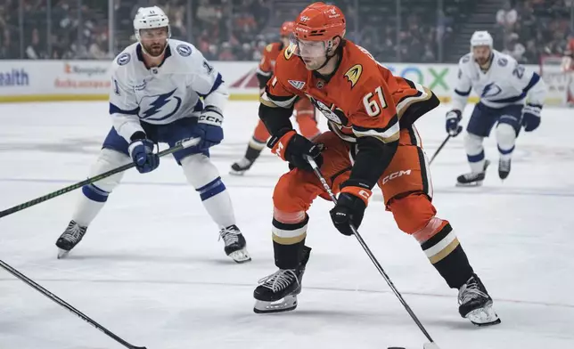 Anaheim Ducks left wing Cutter Gauthier (61) looks to shoot the puck during the first period of an NHL hockey game against the Tampa Bay Lightning, Sunday, Jan. 5, 2025, in Anaheim, Calif. (AP Photo/William Liang)