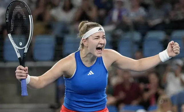 Czechia's Karolina Muchova celebrates her win over Italy's Jasmine Paolini in their quarterfinal match at the United Cup tennis tournament in Sydney, Australia, Friday, Jan. 3, 2025. (AP Photo/Rick Rycroft)