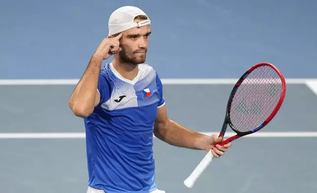 Czechia's Tomas Machac celebrates his win over Italy's Flavio Cobolli during their quarterfinal match at the United Cup tennis tournament in Sydney, Australia, Friday, Jan. 3, 2025. (AP Photo/Rick Rycroft)