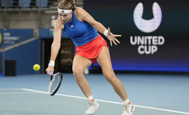 Czechia's Karolina Muchova plays a backhand to Italy's Jasmine Paolini in their quarterfinal match at the United Cup tennis tournament in Sydney, Australia, Friday, Jan. 3, 2025. (AP Photo/Rick Rycroft)