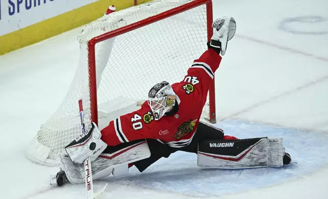 Chicago Blackhawks goalie Arvid Soderblom (40) makes a save during the second period of an NHL hockey game against the Montreal Canadiens, Jan. 3, 2025, in Chicago. (AP Photo/Paul Beaty)