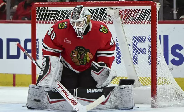 Chicago Blackhawks goalie Arvid Soderblom (40) makes a save during the first period of an NHL hockey game against the Montreal Canadiens, Jan. 3, 2025, in Chicago. (AP Photo/Paul Beaty)