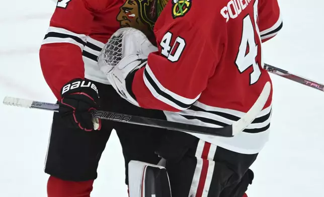 Chicago Blackhawks' Nick Foligno (17) celebrates with goalie Arvid Soderblom (40) after defeating the Montreal Canadiens in an NHL hockey game Jan. 3, 2025, in Chicago. (AP Photo/Paul Beaty)