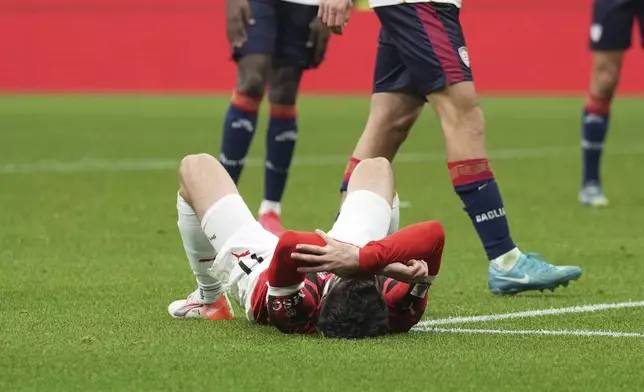 AC Milan's Christian Pulisic reacts after missing a chance to score during the Serie A soccer match between AC Milan and Cagliari at the San Siro stadium, in Milan, Italy, Saturday, Jan. 11, 2025. (AP Photo/Antonio Calanni)