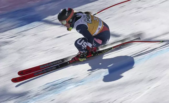 United States' Breezy Johnson speeds down the course during an alpine ski, women's World Cup downhill training, in Cortina d'Ampezzo, Italy, Friday, Jan. 17, 2025. (AP Photo/Marco Trovati)