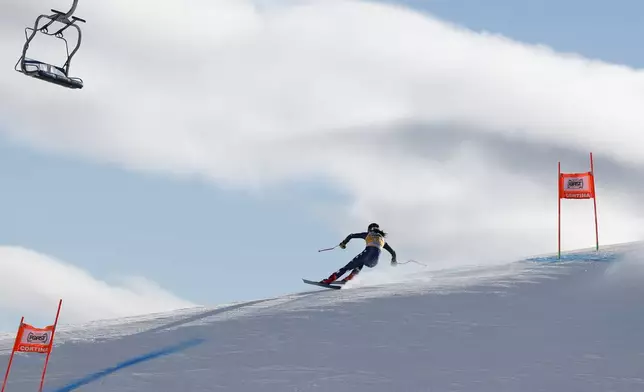 United States' Isabella Wright speeds down the course during an alpine ski, women's World Cup downhill training, in Cortina d'Ampezzo, Italy, Thursday, Jan. 16, 2025. (AP Photo/Alessandro Trovati)