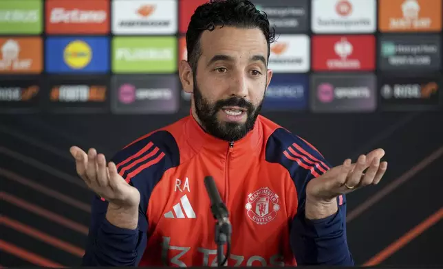Manchester United manager Ruben Amorim gestures during a press conference in Manchester, England, Wednesday, Jan. 22, 2025, ahead of the Europa League soccer match between Manchester United and Rangers FC. (Martin Rickett/PA via AP)