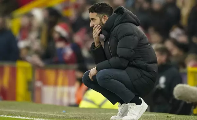 Manchester United's head coach Ruben Amorim follows the game during the English Premier League soccer match between Manchester United and Brighton and Hove Albion, at the Old Trafford stadium in Manchester, England, Sunday, Jan. 19, 2025. (AP Photo/Dave Thompson)