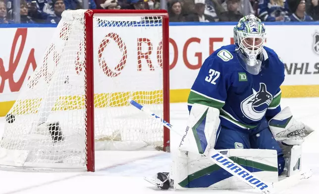 Nashville Predators Steven Stamkos (not shown) scores against Vancouver Canucks goaltender Kevin Lankinen during the second period of an NHL hockey game in Vancouver, British Columbia, Friday, Jan. 3, 2025. (Ethan Cairns/The Canadian Press via AP)