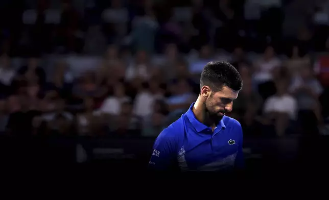 Serbia's Novak Djokovic looks on during his match against USA's Reilly Opelka at the Brisbane International, in Brisbane, Australia, Friday, Jan. 3, 2025. (AP Photo/Pat Hoelscher)