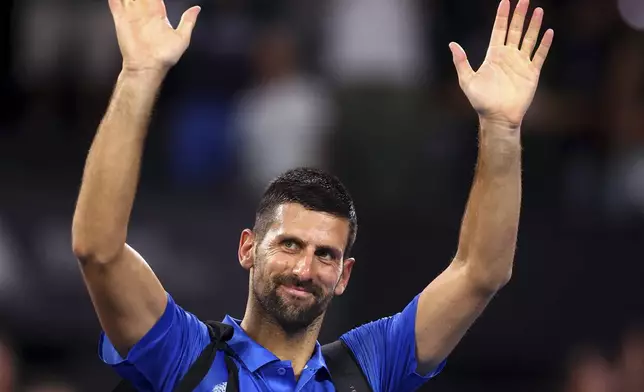 Serbia's Novak Djokovic reacts after losing his match against USA's Reilly Opelka at the Brisbane International, in Brisbane, Australia, Friday, Jan. 3, 2025. (AP Photo/Pat Hoelscher)