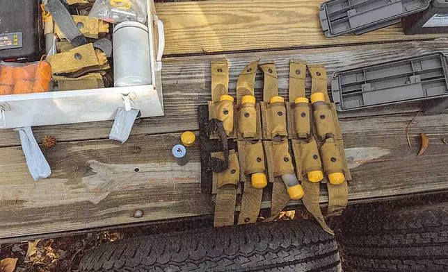 This image provided by U.S. Attorney’s Office, Eastern District of Virginia shows a stockpile of homemade explosives Federal agents seized when they arrested Brad Spafford, a Virginia man on a firearms charge in Dec. 2024. (U.S. Attorney’s Office, Eastern District of Virginia via AP)