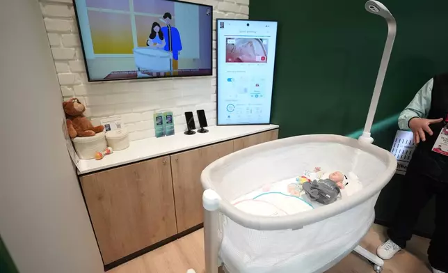 The Bosch Revol Smart Crib is displayed at a Bosch booth during the CES tech show Wednesday, Jan. 8, 2025, in Las Vegas. (AP Photo/Abbie Parr)