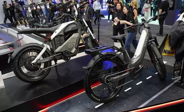 The Segway Xafari, right and Xyber e-bikes sit on display during the CES tech show Tuesday, Jan. 7, 2025, in Las Vegas. (AP Photo/John Locher)