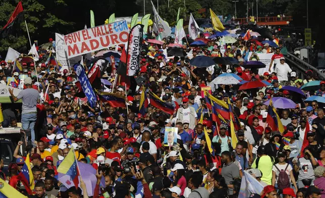 FILE - Pro-government supporters rally for Venezuelan President Nicolas Maduro, in Caracas, Venezuela, Aug. 17, 2024. (AP Photo/Cristian Hernandez, File)