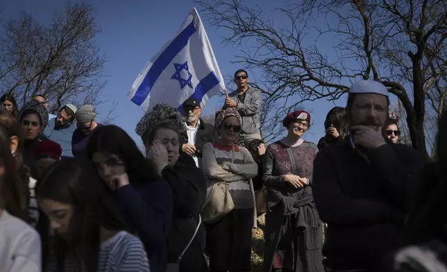 Mourners attend the funeral of Rachel Cohen, 73, and Aliza Raiz, 70, who were killed yesterday in a Palestinian shooting attack in the West Bank, at a cemetery in the West Bank Jewish settlement of Kdumim, Tuesday, Jan. 7, 2025. (AP Photo/Ohad Zwigenberg)