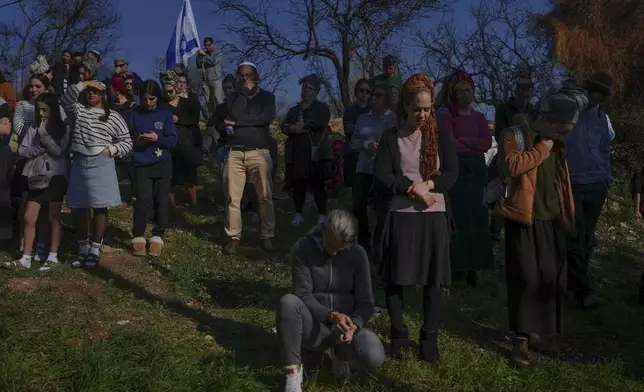 Mourners attend the funeral of Rachel Cohen, 73, and Aliza Raiz, 70, who were killed yesterday in a Palestinian shooting attack in the West Bank, at a cemetery in the West Bank Jewish settlement of Kdumim, Tuesday, Jan. 7, 2025. (AP Photo/Ohad Zwigenberg)