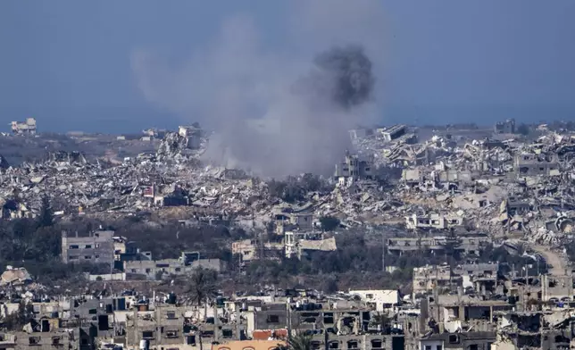 Smoke rises following an explosion in the Gaza Strip, as seen from southern Israel, Tuesday, Jan. 7, 2025. (AP Photo/Ariel Schalit)