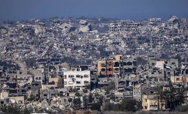 Destroyed buildings are seen inside the Gaza Strip from southern Israel, Tuesday, Jan. 7, 2025. (AP Photo/Ariel Schalit)