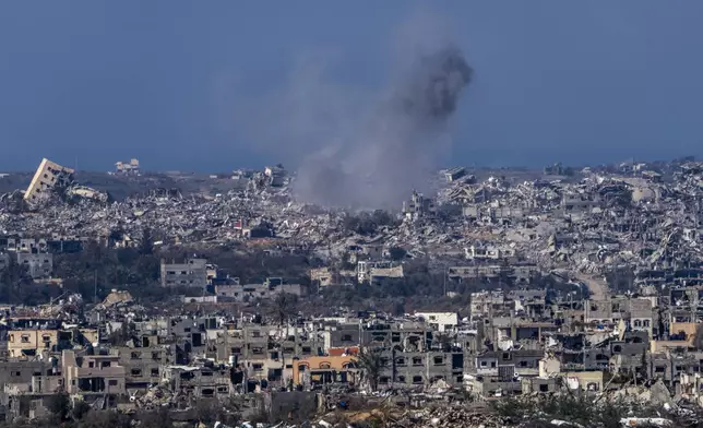 Smoke rises following an explosion in the Gaza Strip, as seen from southern Israel, Tuesday, Jan. 7, 2025. (AP Photo/Ariel Schalit)