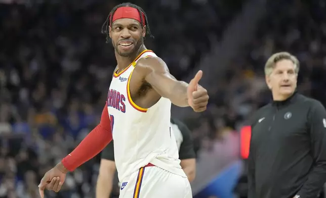 FILE - Golden State Warriors guard Buddy Hield, left, gestures to the Minnesota Timberwolves' bench during the second half of an NBA basketball game in San Francisco, Dec. 8, 2024. (AP Photo/Tony Avelar, File)