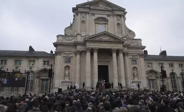 People gather outside Notre Dame du Val-de-Grace church during a public memorial for late far-right leader Jean-Marie Le Pen, Thursday, Jan. 16, 2025 in Paris. Jean-Marie Le Pen, the founder of France's main far-right party, died on Jan.7, 2025 aged 96. (AP Photo/Michel Euler)