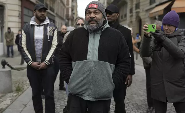Dieudonne M'Bala M'Bala, a French comedian repeatedly convicted of inciting antisemitism or racial hatred, stays outside Notre Dame du Val-de-Grace church during a public memorial for late far-right leader Jean-Marie Le Pen, Thursday, Jan. 16, 2025 in Paris. Jean-Marie Le Pen, the founder of France's main far-right party, died on Jan.7, 2025 aged 96. (AP Photo/Thibault Camus)