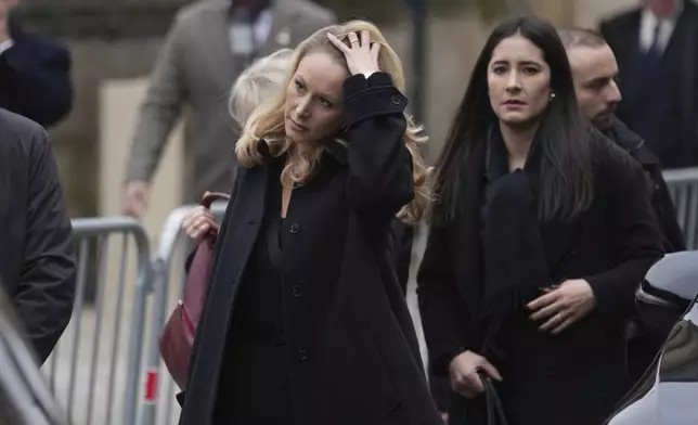 Marion Marechal, center, arrives at Notre Dame du Val-de-Grace church for a public memorial for her grand-father and late far-right leader Jean-Marie Le Pen, Thursday, Jan. 16, 2025 in Paris. Jean-Marie Le Pen, the founder of France's main far-right party, died on Jan.7, 2025 aged 96. (AP Photo/Thibault Camus)