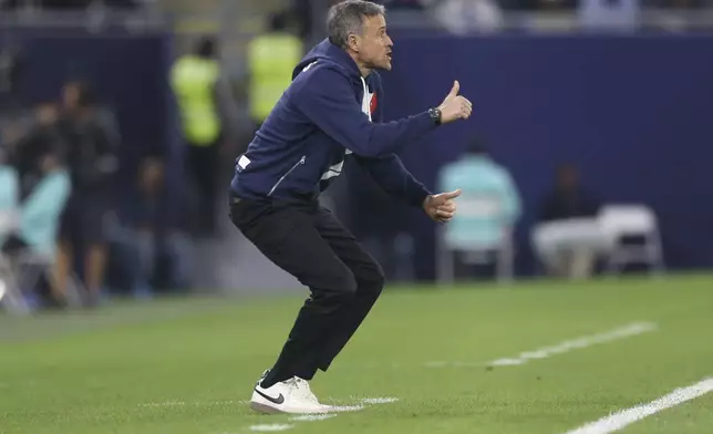 PSG's head coach Luis Enrique shouts instructions during the French Super Cup final match between Paris Saint Germain and Monaco in Doha, Qatar, on Sunday, Jan. 5, 2025.(AP Photo/Hussein Sayed)