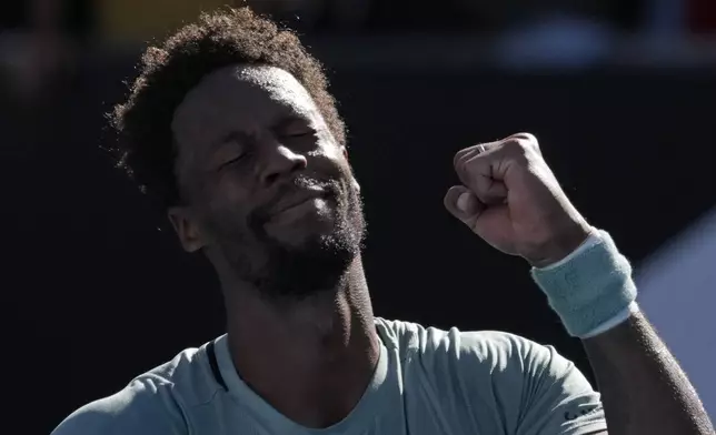 Gael Monfils of France celebrates after defeating compatriot Giovanni Mpetshi Perricard in their first round match at the Australian Open tennis championship in Melbourne, Australia, Tuesday, Jan. 14, 2025. (AP Photo/Manish Swarup)