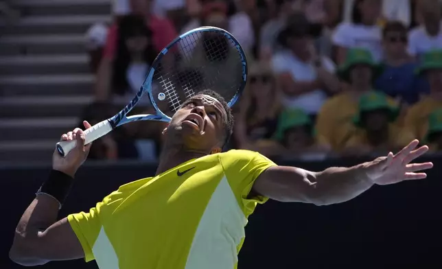 Giovanni Mpetshi Perricard of France serves to compatriot Gael Monfils during their first round match at the Australian Open tennis championship in Melbourne, Australia, Tuesday, Jan. 14, 2025. (AP Photo/Asanka Brendon Ratnayake)