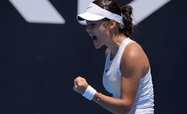 Emma Raducanu of Britain reacts after winning a point against Ekaterina Alexandrova of Russia during their first round match at the Australian Open tennis championship in Melbourne, Australia, Tuesday, Jan. 14, 2025. (AP Photo/Manish Swarup)