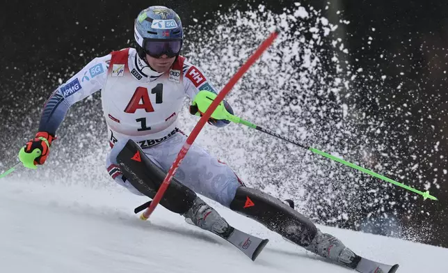 Norway's Timon Haugan speeds down the course during an alpine ski, men's World Cup slalom, in Kitzbühel, Austria, Sunday, Jan. 26, 2025. (AP Photo/Marco Trovati)