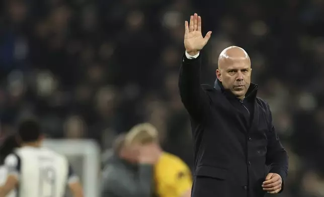 Liverpool's manager Arne Slot greets fans at the end of the English League Cup semi final first leg soccer match between Tottenham and Liverpool, at the Tottenham Hotspur Stadium in London, Wednesday, Jan. 8, 2025. (AP Photo/Ian Walton)