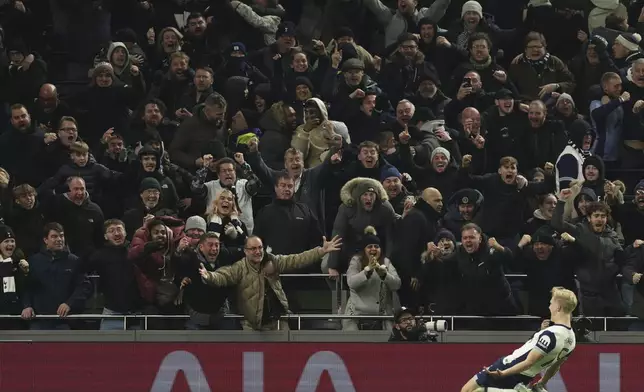 Tottenham's Lucas Bergvall celebrates after scoring the opening goal during the English League Cup semi final first leg soccer match between Tottenham and Liverpool, at the Tottenham Hotspur Stadium in London, Wednesday, Jan. 8, 2025. (AP Photo/Ian Walton)