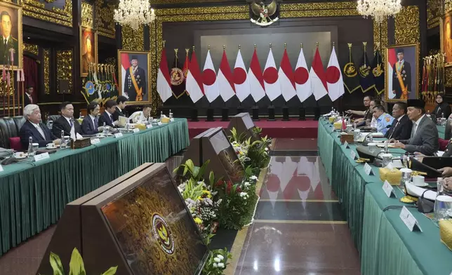 Japan's Defense Minister Gen Nakatani, left, attends a bilateral meeting with his Indonesian counterpart Sjafrie Sjamsoeddin, right, in Jakarta, Indonesia, Tuesday, Jan. 7, 2025. (AP Photo/Achmad Ibrahim)